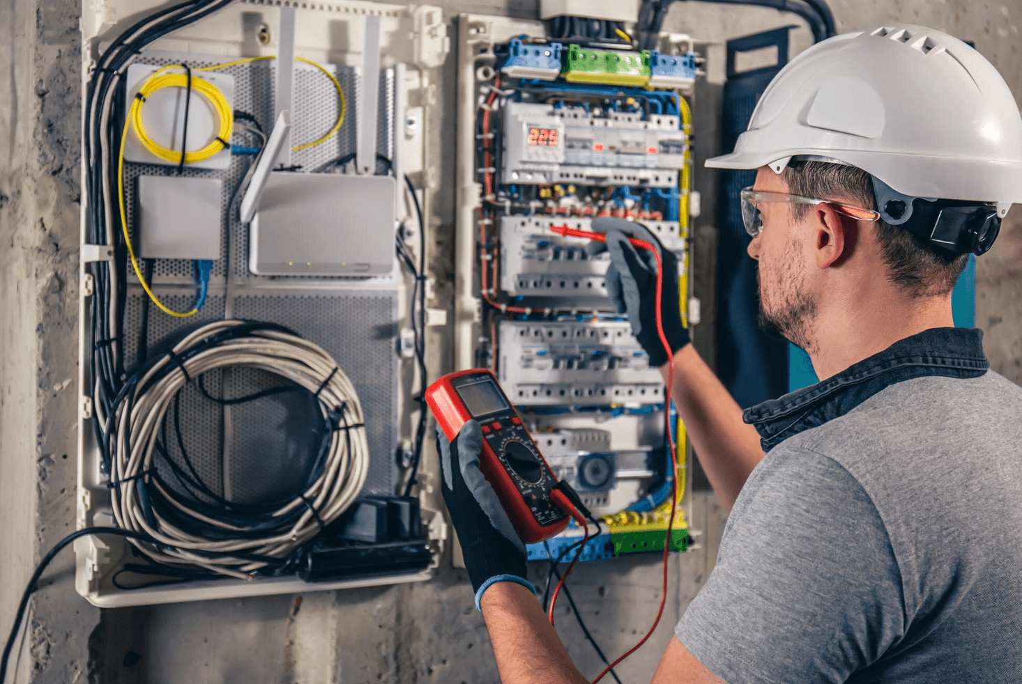 Electrician working on an electrical panel